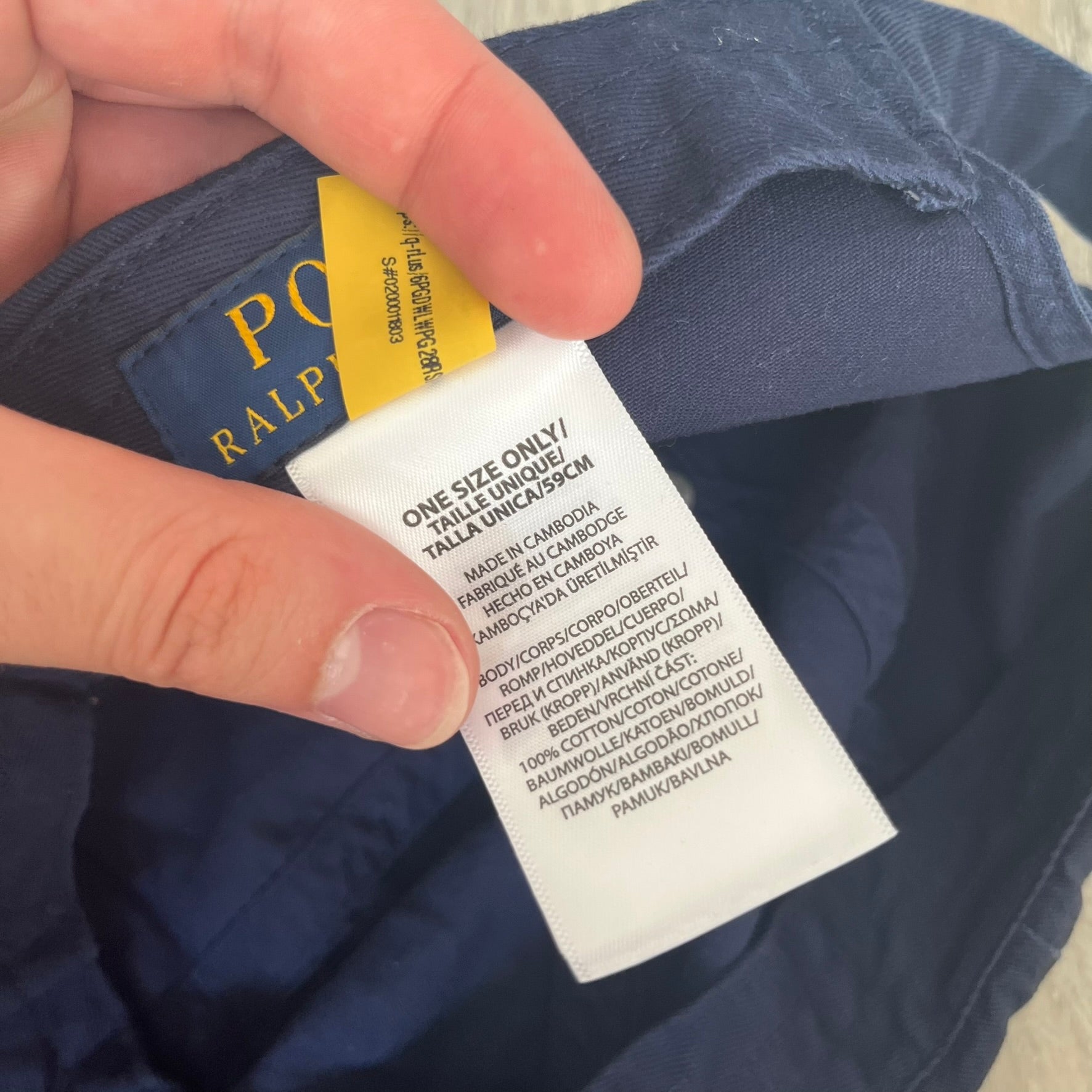 Ralph Lauren x Fortnite Navy Logo Baseball Cap is a navy cotton cap featuring bold embroidered branding on the front, including red Polo Ralph Lauren text and a Fortnite logo patch combined with a USA Ralph Lauren crest. The back includes a white embroidered Ralph Lauren logo and an adjustable strap for a custom fit.