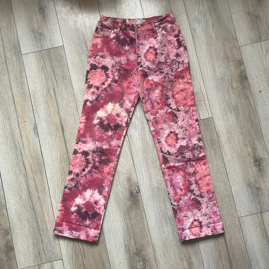 Roberto Cavalli Pink Floral 2000’s Jeans are made in Italy from 98% cotton and 2% elastane. The jeans feature an all-over floral print in multiple shades of pink, ranging from light to dark, with a hand-painted effect across the fabric. Details include branded buttons, a leather logo tab at the back, and classic five-pocket construction with two front and two back pockets.