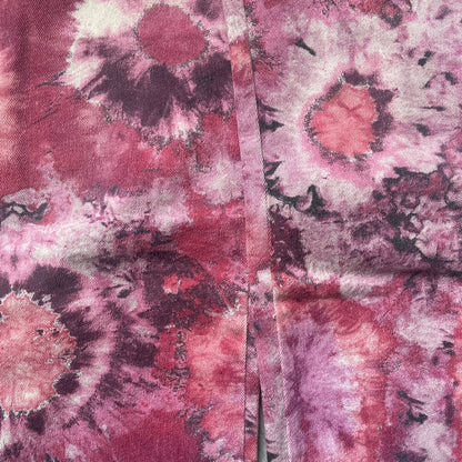 Roberto Cavalli Pink Floral 2000’s Jeans are made in Italy from 98% cotton and 2% elastane. The jeans feature an all-over floral print in multiple shades of pink, ranging from light to dark, with a hand-painted effect across the fabric. Details include branded buttons, a leather logo tab at the back, and classic five-pocket construction with two front and two back pockets.