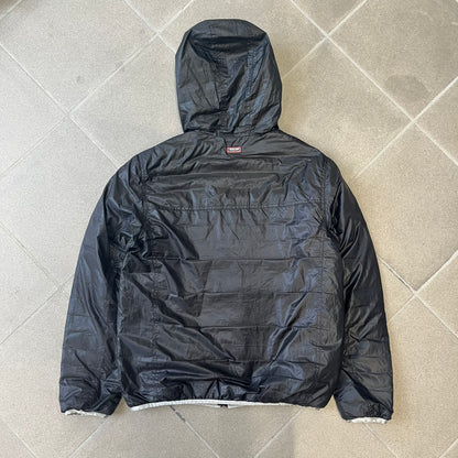 Roberto Cavalli Sport 2010's Black Lightweight Jacket is a lightweight hooded jacket in black with a gray interior, featuring two front pockets and star logo zipper pulls. A rubber Roberto Cavalli Sport logo patch sits on the chest, with a smaller matching patch on the upper back.