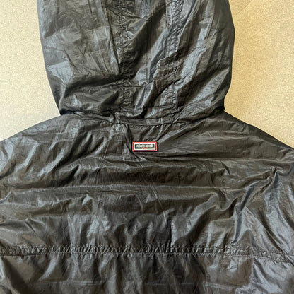 Roberto Cavalli Sport 2010's Black Lightweight Jacket is a lightweight hooded jacket in black with a gray interior, featuring two front pockets and star logo zipper pulls. A rubber Roberto Cavalli Sport logo patch sits on the chest, with a smaller matching patch on the upper back.
