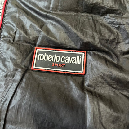 Roberto Cavalli Sport 2010's Black Lightweight Jacket is a lightweight hooded jacket in black with a gray interior, featuring two front pockets and star logo zipper pulls. A rubber Roberto Cavalli Sport logo patch sits on the chest, with a smaller matching patch on the upper back.