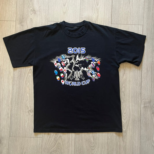 2015 Rugby World Cup tee featuring a front print with a world map, all participating countries, and “2015 World Cup” text. The back displays the date and location of the grand final along with the text “20 teams – only 1 winner.” An official commemorative piece from the 2015 tournament.