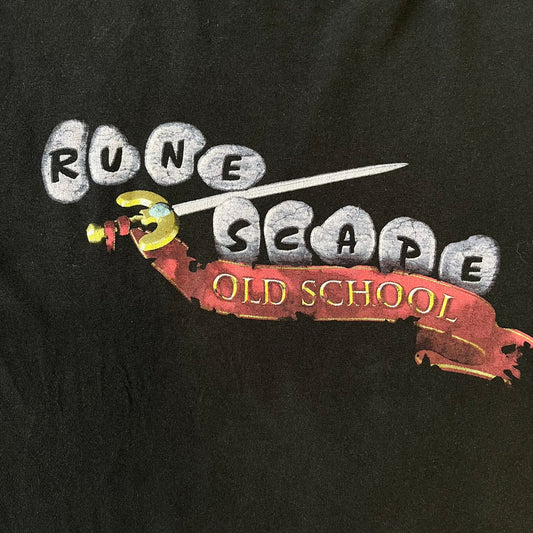 RuneScape Old School 2010's Logo Tee features a black construction with the RuneScape Old School logo printed on the front. The shirt was available through the official Jagex store and dates from the late 2010s to 2020s. Made on a Gildan blank.
