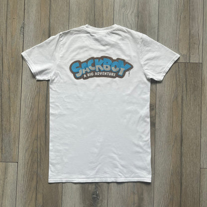 Sackboy: A Big Adventure 2020 White Promo Tee is a white cotton T-shirt featuring official Sony licensing and a “not for sale” internal tag. The front includes a small printed faux chest pocket design with Sackboy waving from inside it. The upper back displays a large “Sackboy: A Big Adventure” game logo print.
