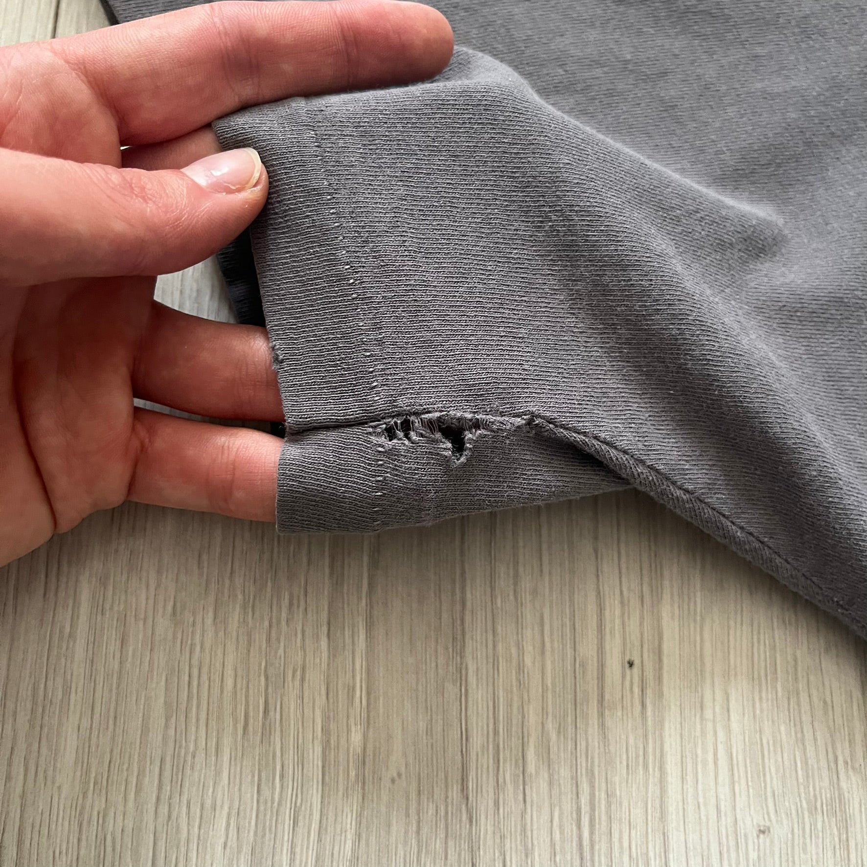 Gray Scooby-Doo tee from 1998, officially licensed by Warner Bros. Studio Store. Graphic shows Scooby emerging through the shirt as if he tore it, paired with classic text. Single-stitch USA-made construction adds authentic vintage charm.