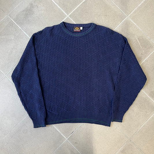 Sedgefield 1990's Basketweave Navy Sweater is a heavyweight navy sweater made in the USA, featuring a thin green line detail on the collar.