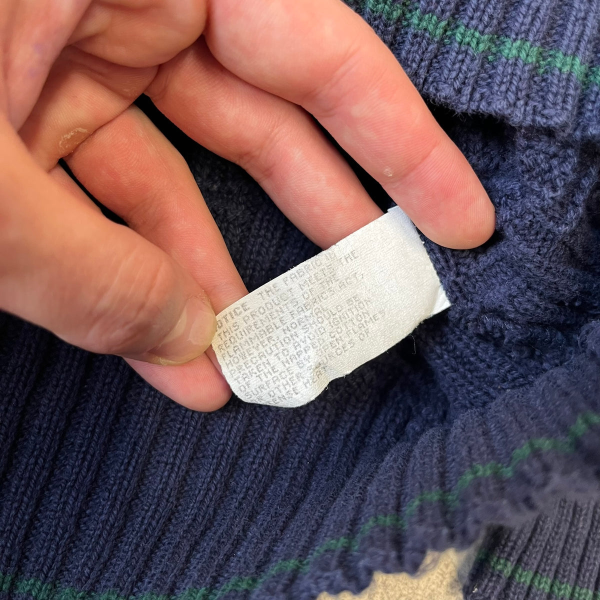 Sedgefield 1990's Basketweave Navy Sweater is a heavyweight navy sweater made in the USA, featuring a thin green line detail on the collar.
