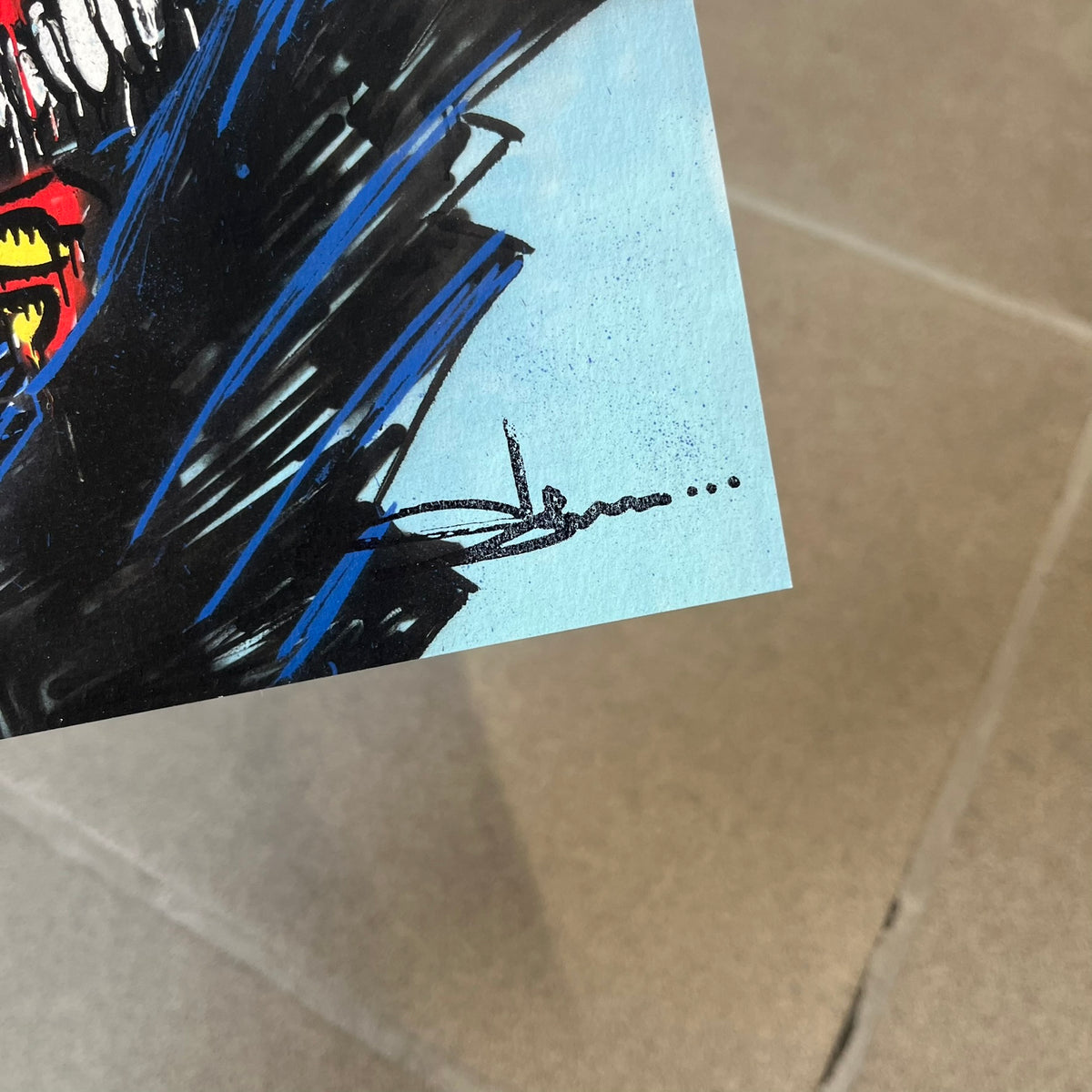 Slawn 2026 Batman Print is a high-quality A5 print bought at a Rolex event featuring Slawn, depicting a deformed Batman in dark blue-black with a signature Slawn-style scary face against a light blue background. It carries Slawn's signature in the bottom right, and the original artwork was painted in 2025.