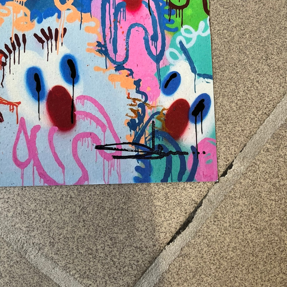 Slawn 2026 Scary Sights Print is a high-quality A5 print of Slawn's "Scary Sights" painting, featuring multiple colorful sad faces with Slawn's signature in the bottom right. The print was produced for the Rolex event tied to the Playboi Carti watch.