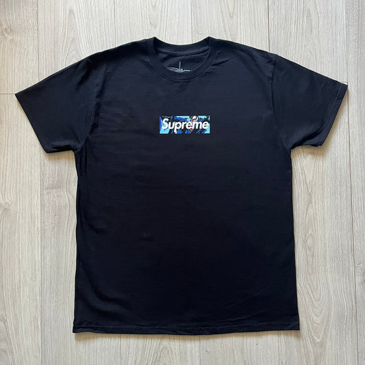  Black Batpreme tee designed by Slawn with Supreme Box Logo and his iconic Batman graphic on the front. Printed neck tag with signature and back shows handwritten-style text saying “This really isn’t real Supreme” with Slawn signature and the Supreme bogo. A rare, art-driven streetwear essential.