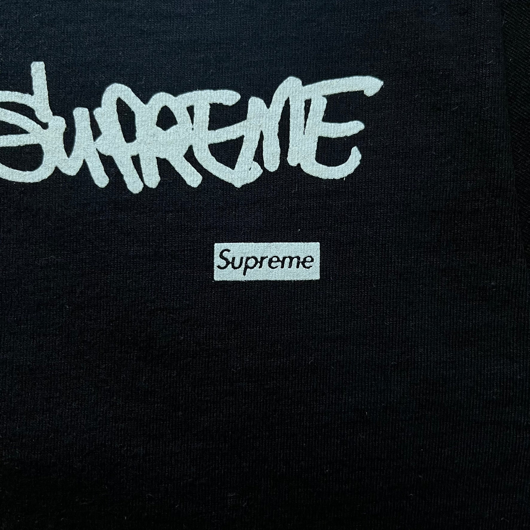 Black Batpreme tee designed by Slawn with Supreme Box Logo and his iconic Batman graphic on the front. Printed neck tag with signature and back shows handwritten-style text saying “This really isn’t real Supreme” with Slawn signature and the Supreme bogo. A rare, art-driven streetwear essential.