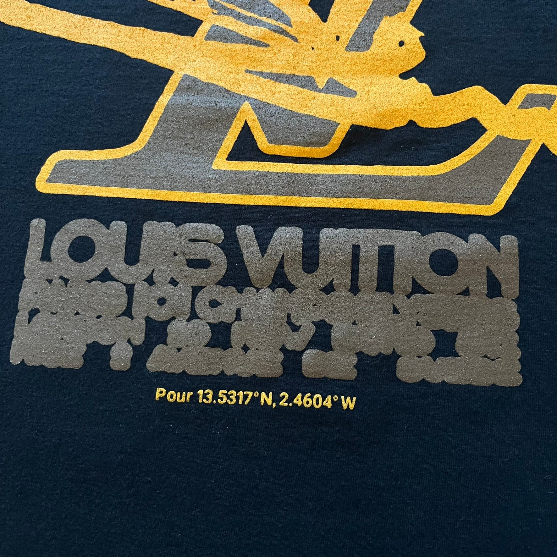 Louis Vuitton logo on a dark background with gold and gray text.