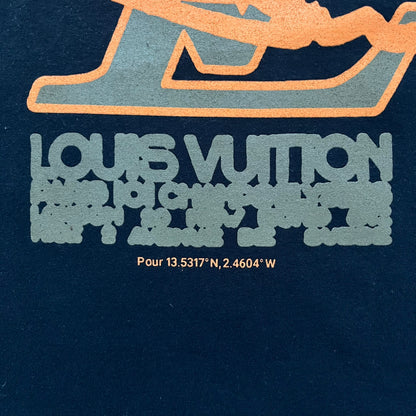The Slawn LV Black Tee, given away at the Paris Pop-up in 2024, features a orange-brown LV logo on the front. Despite the branding, this is a Slawn creation, not an official Louis Vuitton piece.