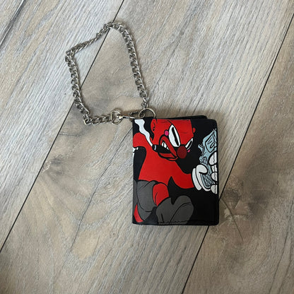 Slawn Leather Chain Man Wallet is a black foldable leather wallet featuring original artwork by Slawn on the front, depicting a red running figure holding a revolver and smoking a cigar. The wallet includes an attached metal chain for securing to clothing, along with eight card compartments and one top compartment for cash.