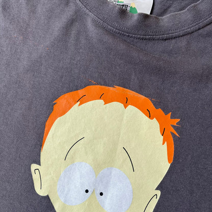 South Park 2008 Timmy “I’m Special” Tee features a grey T-shirt with a front graphic of Timmy’s face above a blue bar with white “I’m Special” text. Small 2008 licensing and Comedy Central details are printed underneath. The back features a blue and white wheelchair-accessibility sign graphic. Includes a licensed South Park neck tag.
