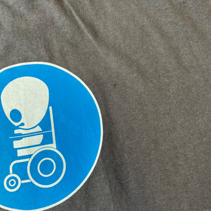 South Park 2008 Timmy “I’m Special” Tee features a grey T-shirt with a front graphic of Timmy’s face above a blue bar with white “I’m Special” text. Small 2008 licensing and Comedy Central details are printed underneath. The back features a blue and white wheelchair-accessibility sign graphic. Includes a licensed South Park neck tag.
