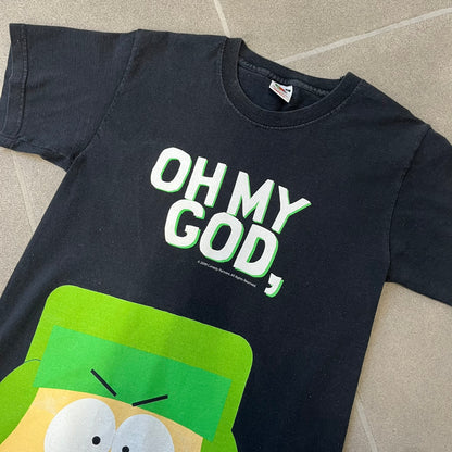 South Park 2009 “Oh My God, They Killed Kenny!” Tee is a black T-shirt made on a Fruit of the Loom blank. The front features a large graphic of Kyle with “Oh My God,” printed above and 2009 South Park licensing below. The back shows a stitched version of Kenny with “They Killed Kenny!” printed above the graphic.
