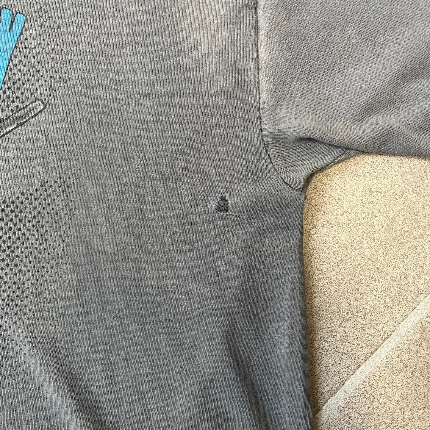 South Park 2009 “Respect My Authority” Gray Tee features a grey T-shirt with a front graphic of Cartman wearing a police uniform and running across a dotted cartoon-style background. Above the graphic is white and blue “Respect My Authority” text. The shirt has a South Park 2009 licensed neck tag and a heavily worn, distressed condition.

