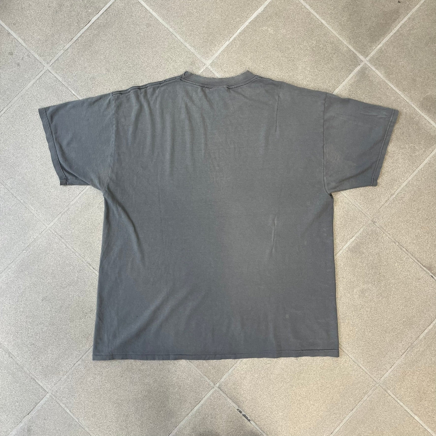South Park 2009 “Respect My Authority” Gray Tee features a grey T-shirt with a front graphic of Cartman wearing a police uniform and running across a dotted cartoon-style background. Above the graphic is white and blue “Respect My Authority” text. The shirt has a South Park 2009 licensed neck tag and a heavily worn, distressed condition.
