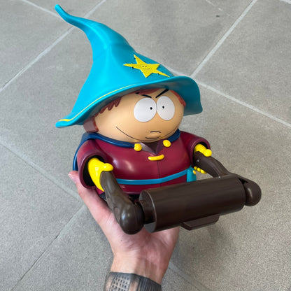 Unique South Park Snow Day exclusive featuring Grand Wizard Cartman as a talking toilet paper holder. The figure delivers iconic quotes while the roll turns, complete with a wooden-style holder design. A must-have collectible for South Park enthusiasts. No batteries!