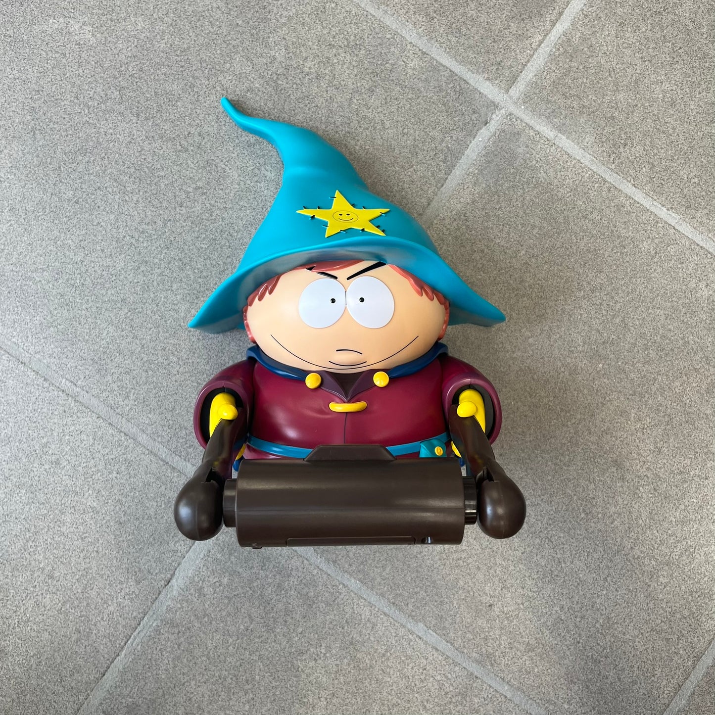 Unique South Park Snow Day exclusive featuring Grand Wizard Cartman as a talking toilet paper holder. The figure delivers iconic quotes while the roll turns, complete with a wooden-style holder design. A must-have collectible for South Park enthusiasts. No batteries!