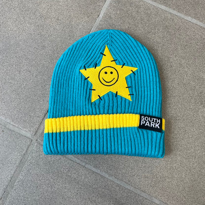 Exclusive South Park Snow Day Collector’s Edition Grand Wizard Cartman Beanie. Teal knit with yellow stripe detailing, embroidered yellow star with stitched effect, and official South Park branding tag. Made from a soft, stretchy material for a comfortable fit.