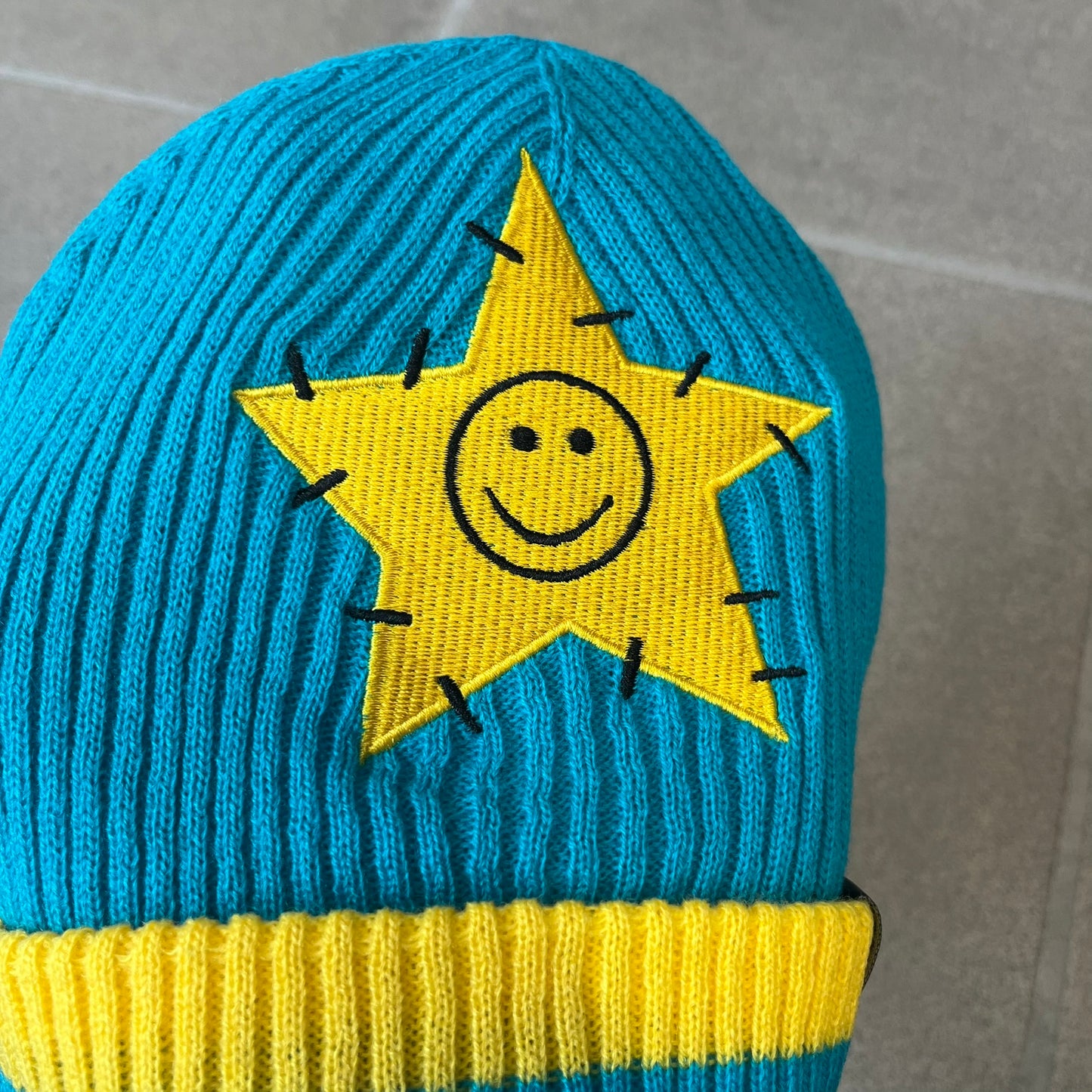 Exclusive South Park Snow Day Collector’s Edition Grand Wizard Cartman Beanie. Teal knit with yellow stripe detailing, embroidered yellow star with stitched effect, and official South Park branding tag. Made from a soft, stretchy material for a comfortable fit.
