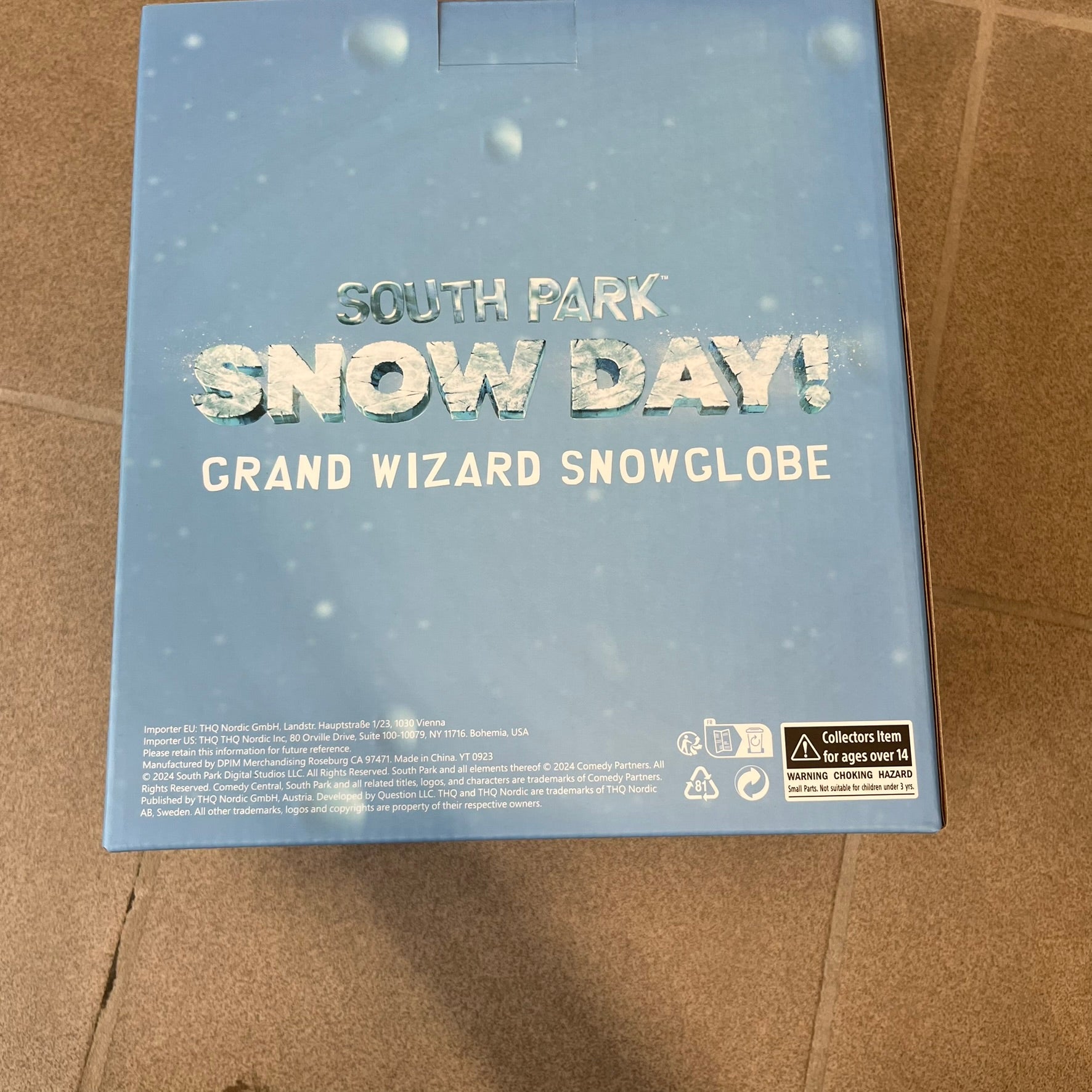 Exclusive South Park Snow Day Grand Wizard Cartman Snowglobe. Showcases Cartman in full wizard attire within a globe packed with dense snow for a humorous effect, making Cartman almost disappear beneath the flakes. Officially licensed piece with 2024 Comedy Partners text on the base.