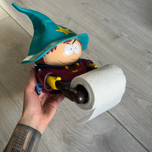 Unique South Park Snow Day exclusive featuring Grand Wizard Cartman as a talking toilet paper holder. The figure delivers iconic quotes while the roll turns, complete with a wooden-style holder design. A must-have collectible for South Park enthusiasts.