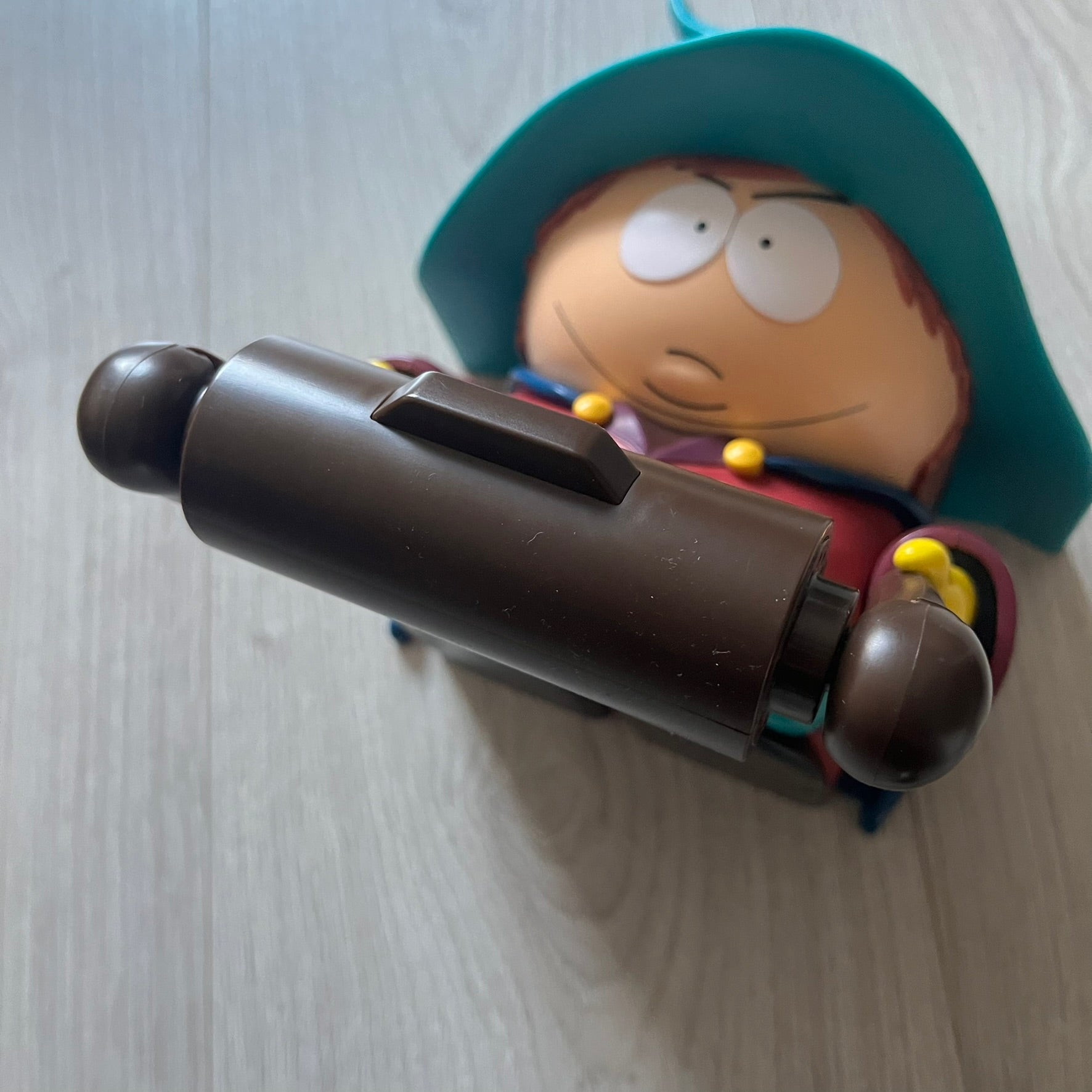 Unique South Park Snow Day exclusive featuring Grand Wizard Cartman as a talking toilet paper holder. The figure delivers iconic quotes while the roll turns, complete with a wooden-style holder design. A must-have collectible for South Park enthusiasts.