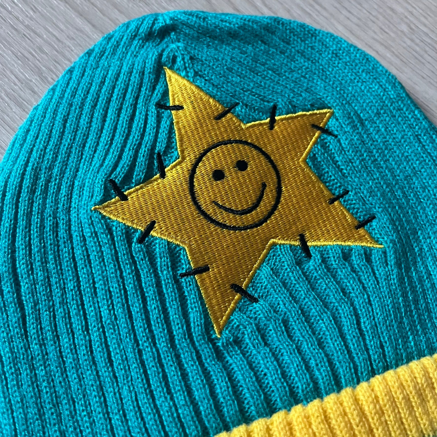 Exclusive South Park Snow Day Collector’s Edition Grand Wizard Cartman Beanie. Teal knit with yellow stripe detailing, embroidered yellow star with stitched effect, and official South Park branding tag. Made from a soft, stretchy material for a comfortable fit.