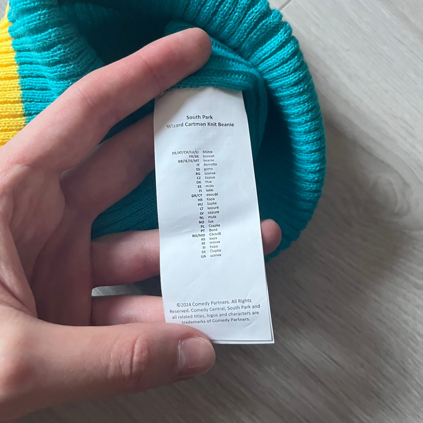 Exclusive South Park Snow Day Collector’s Edition Grand Wizard Cartman Beanie. Teal knit with yellow stripe detailing, embroidered yellow star with stitched effect, and official South Park branding tag. Made from a soft, stretchy material for a comfortable fit.