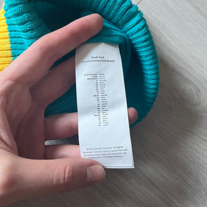 Exclusive South Park Snow Day Collector’s Edition Grand Wizard Cartman Beanie. Teal knit with yellow stripe detailing, embroidered yellow star with stitched effect, and official South Park branding tag. Made from a soft, stretchy material for a comfortable fit.