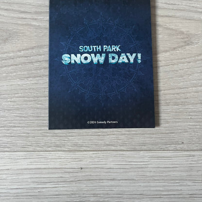 Set of 6 South Park Snow Day tarot cards, exclusive to the Collector’s Edition. Features characters like the Emo Kids with designs such as “Prince of Ravens” and “Non-Conformist.” Each card has dark red and black front artwork with a blue South Park Snow Day back.