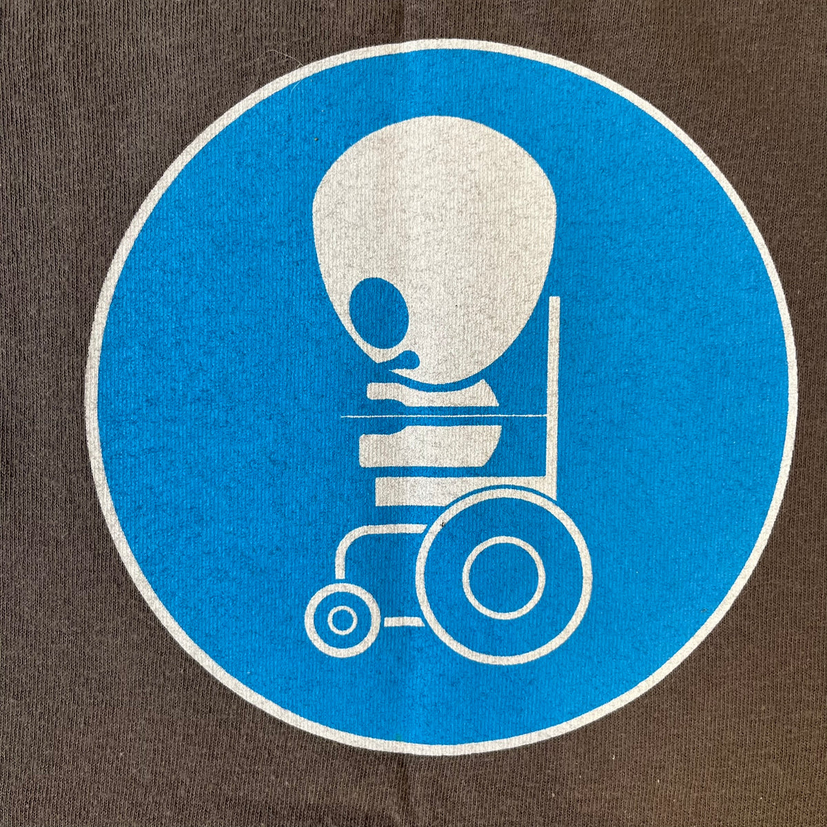 South Park 2008 Timmy “I’m Special” Tee features a grey T-shirt with a front graphic of Timmy’s face above a blue bar with white “I’m Special” text. The back features a blue and white wheelchair-accessibility sign graphic and 4 main characters white outlines with small 2008 licensing and Comedy Central details printed underneath.