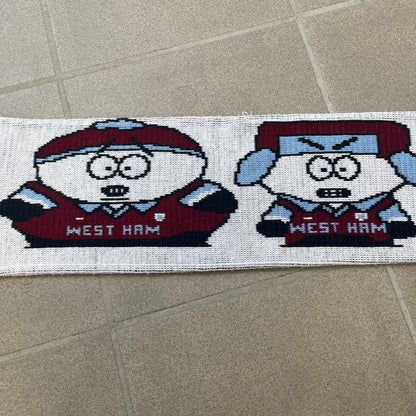 Vintage South Park West Ham 1990's Football Scarf in white and burgundy with fringe / tassels, featuring South Park characters including Kenny, Cartman, Kyle and Stan dressed in West Ham kits. The character graphics appear on both sides of the scarf, with consistent coloring in Burgundy and light blue.