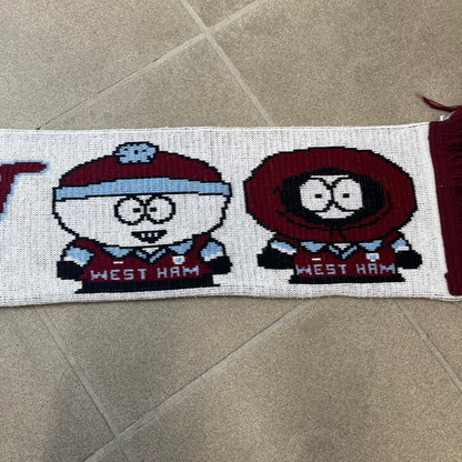 Vintage South Park West Ham 1990's Football Scarf in white and burgundy with fringe / tassels, featuring South Park characters including Kenny, Cartman, Kyle and Stan dressed in West Ham kits. The character graphics appear on both sides of the scarf, with consistent coloring in Burgundy and light blue.