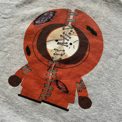 South Park “Stitched Up Kenny” Hoodie from 1998 in Gray, made on a Screen Stars blank. Features a small South Park logo on the chest and a large stitched-up Kenny graphic on the back. Vintage licensed piece from the show’s early era.