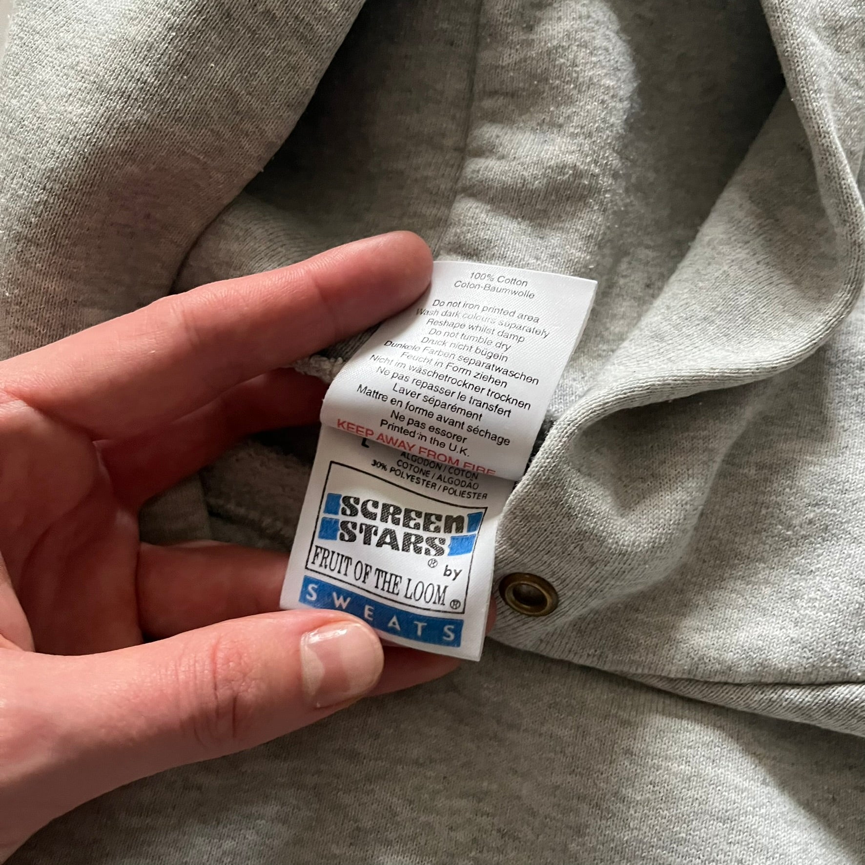 South Park “Stitched Up Kenny” Hoodie from 1998 in Gray, made on a Screen Stars blank. Features a small South Park logo on the chest and a large stitched-up Kenny graphic on the back. Vintage licensed piece from the show’s early era.