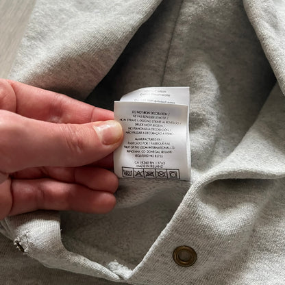 South Park “Stitched Up Kenny” Hoodie from 1998 in Gray, made on a Screen Stars blank. Features a small South Park logo on the chest and a large stitched-up Kenny graphic on the back. Vintage licensed piece from the show’s early era.