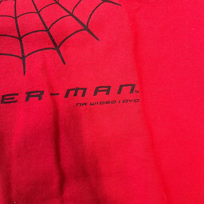 Spider-Man 2002 Hoop Cola Promo Red Crewneck is a rare Poland-exclusive crewneck made for the cross-promotional campaign between Hoop Cola and Warner Bros for the Spider-Man (2002) film. It was never sold in stores and was given out only as a prize in the SMS code contest. The cotton crewneck features web with eyes graphic in the middle, Spider-Man logo under and a Hoop Cola logo above.