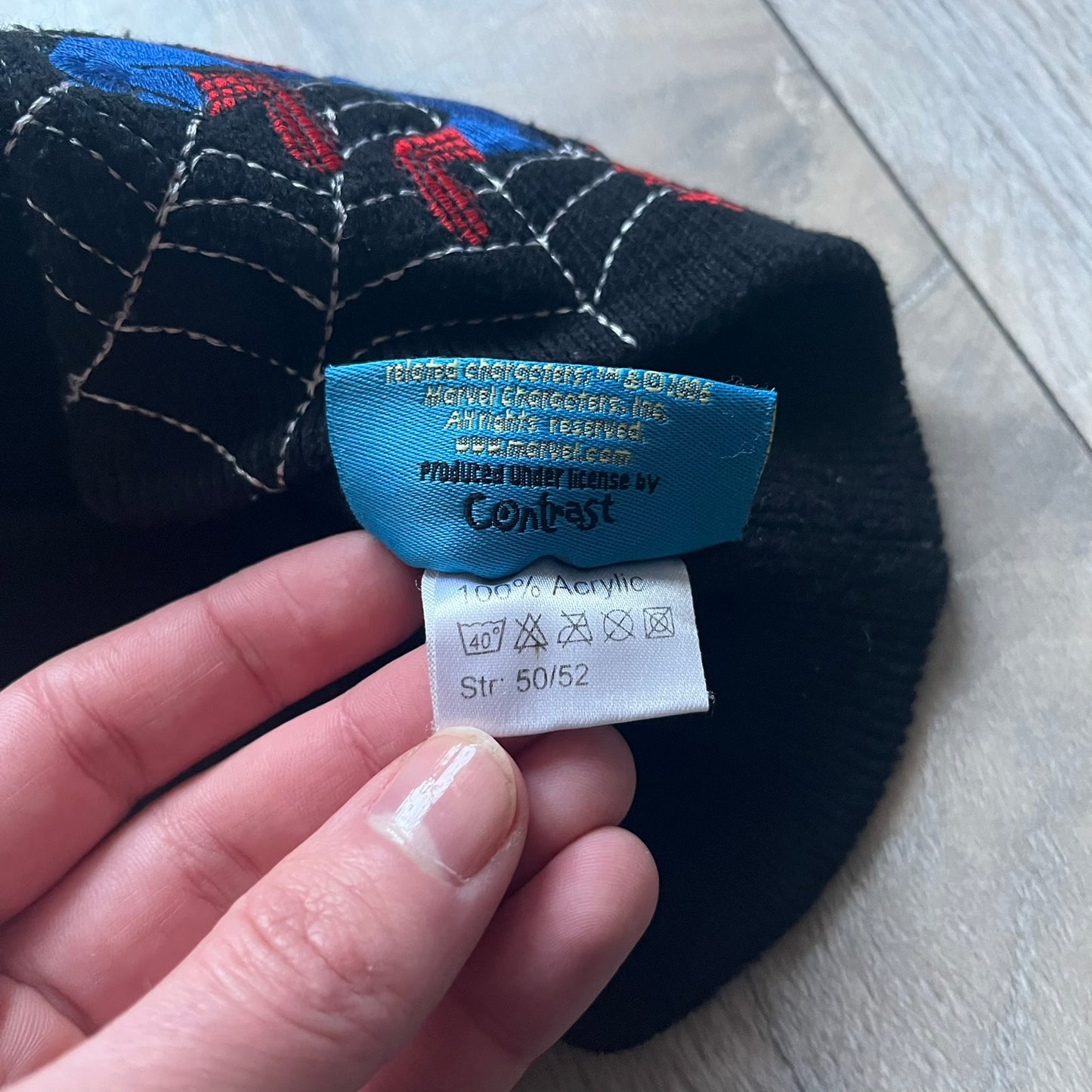 This vintage 2006 Spider-Man beanie by Contrast comes in black and features an embroidered design of Spider-Man on a web with “The Amazing Spider-Man” text. Officially licensed, it’s a nostalgic collectible that captures the mid-2000s comic and pop culture era.