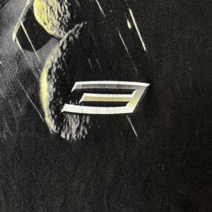 Spider-Man 3 Blacksuit 2007 Poster Tee features a black 100% cotton T-shirt with a large front graphic of Spider-Man crouching in the black suit in the rain. A “3” is printed in the bottom-right corner of the graphic. The shirt has a 2007 licensed black neck tag.
