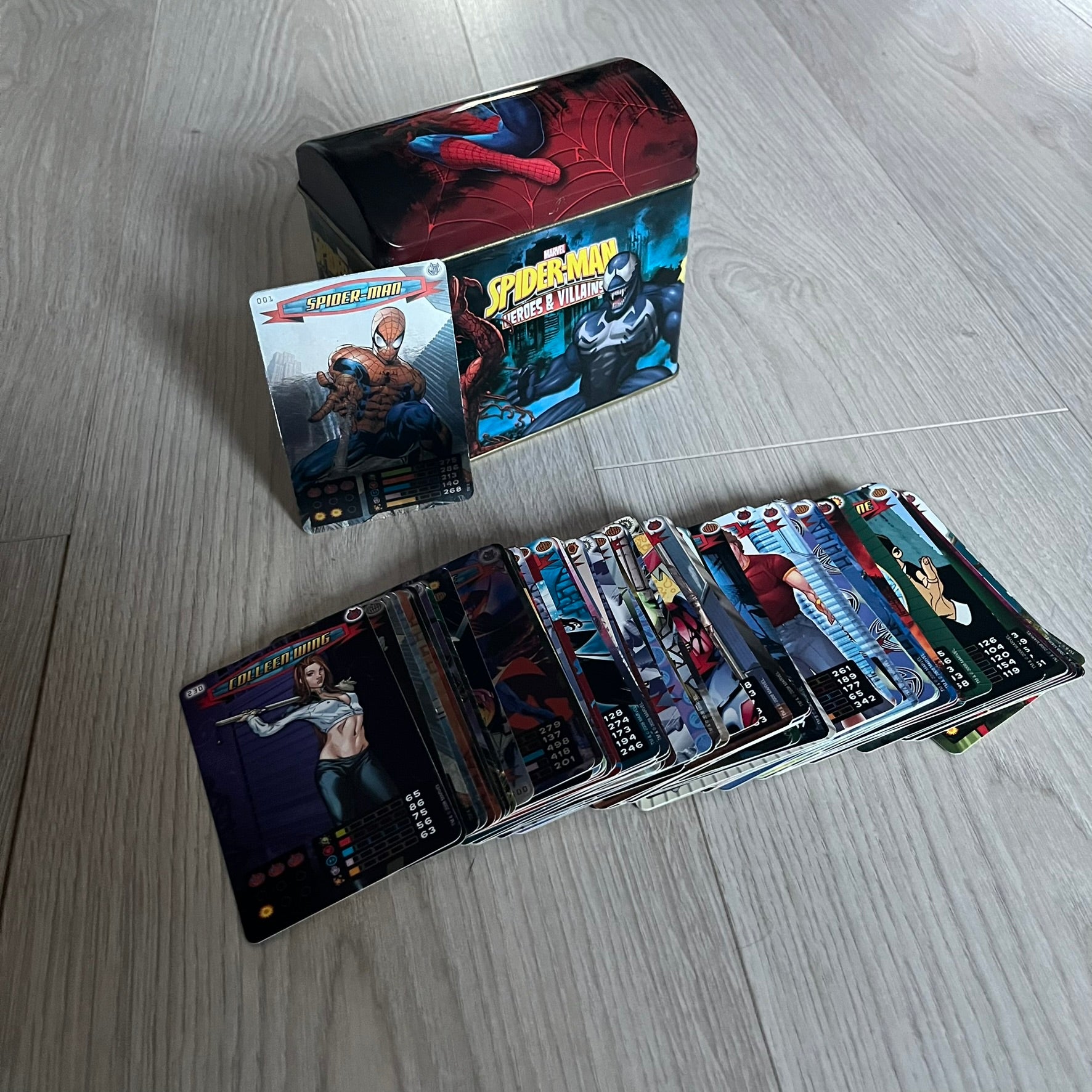 Spider-Man Heroes &amp; Villains 2008 Card Set includes 71 standard cards and 12 foil cards, stored in a collectible metal box. Originally sold with the Spider-Man Heroes &amp; Villains Collection magazine, these cards can be collected or used to play multiple official games.