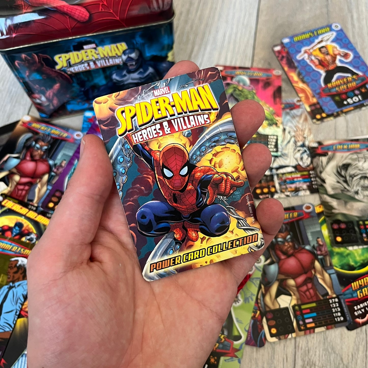 Spider-Man Heroes &amp; Villains 2008 Card Set includes a random amount of foil and standard cards, stored in a collectible metal box. Originally sold with the Spider-Man Heroes &amp; Villains Collection magazine, these cards can be collected or used to play multiple official games.