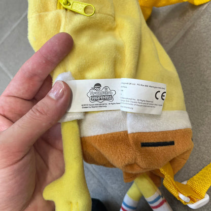 SpongeBob SquarePants 2010 Backpack is designed in the shape of SpongeBob’s body with embroidered facial details, a 3D nose, and loose hanging arms and legs. It features one main compartment and a yellow 2010 licensed tag on the side.
