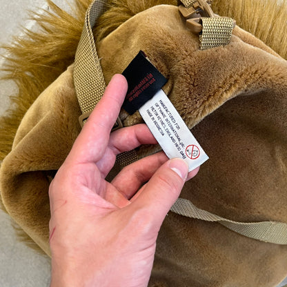  Star Wars 1990s Chewbacca Head Backpack is a novelty bag designed in the shape of Chewbacca’s head. The exterior features a furry construction with plastic eyes and a leather-like nose and mouth. It includes an adjustable shoulder straps, a single main compartment and a red Star Wars licensed tag.