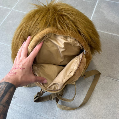 Star Wars 1990s Chewbacca Head Backpack is a novelty bag designed in the shape of Chewbacca’s head. The exterior features a furry construction with plastic eyes and a leather-like nose and mouth. It includes an adjustable shoulder straps, a single main compartment and a red Star Wars licensed tag.