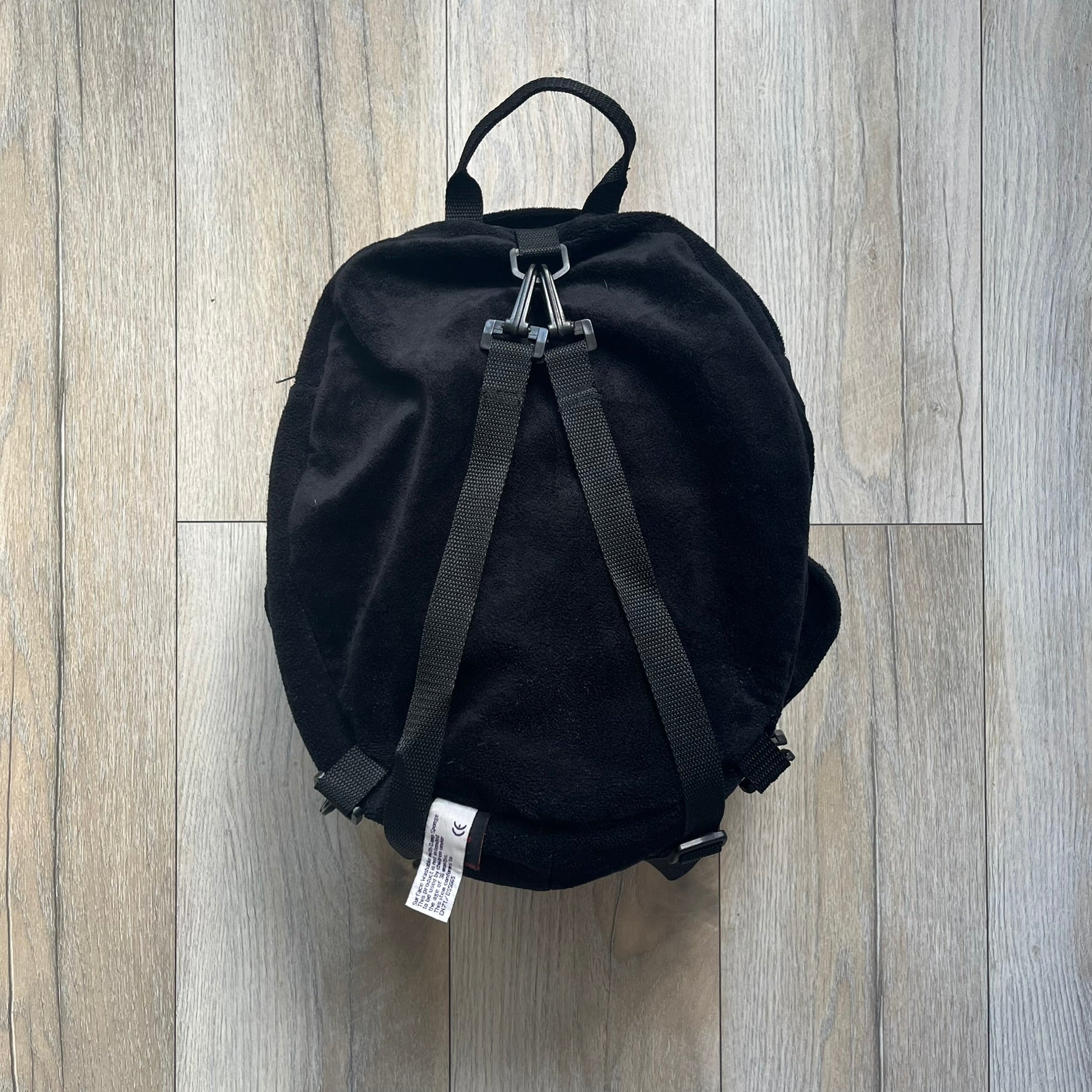 Star Wars 90's Darth Maul Head Backpack is a plush backpack shaped like Darth Maul’s head with striking red-and-black detailing and realistic plastic eyes. Features a small zip compartment on the back and adjustable straps, perfect as a collectible or standout accessory.